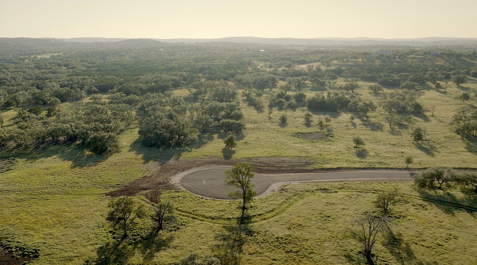 Aerial view of Hill Country oak woodland and open pasture at Prochnow Oaks Ranch
